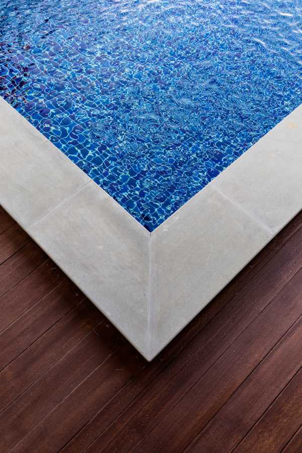 personalized stamped concrete pattern to create the homeowner's poolside dream