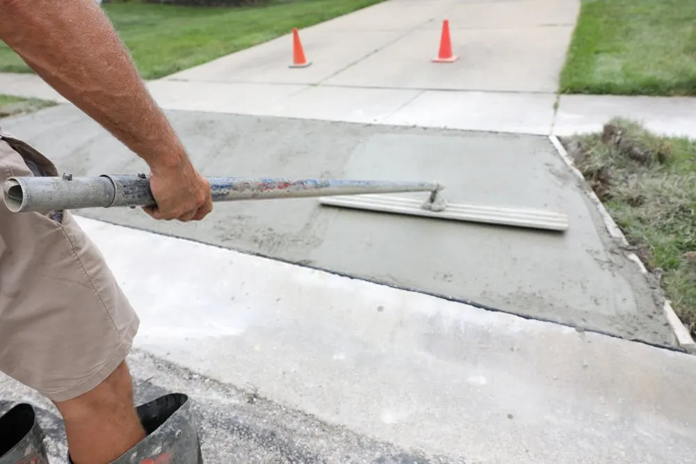 plain concrete driveway installed in a residential property in Golden Gate, FL