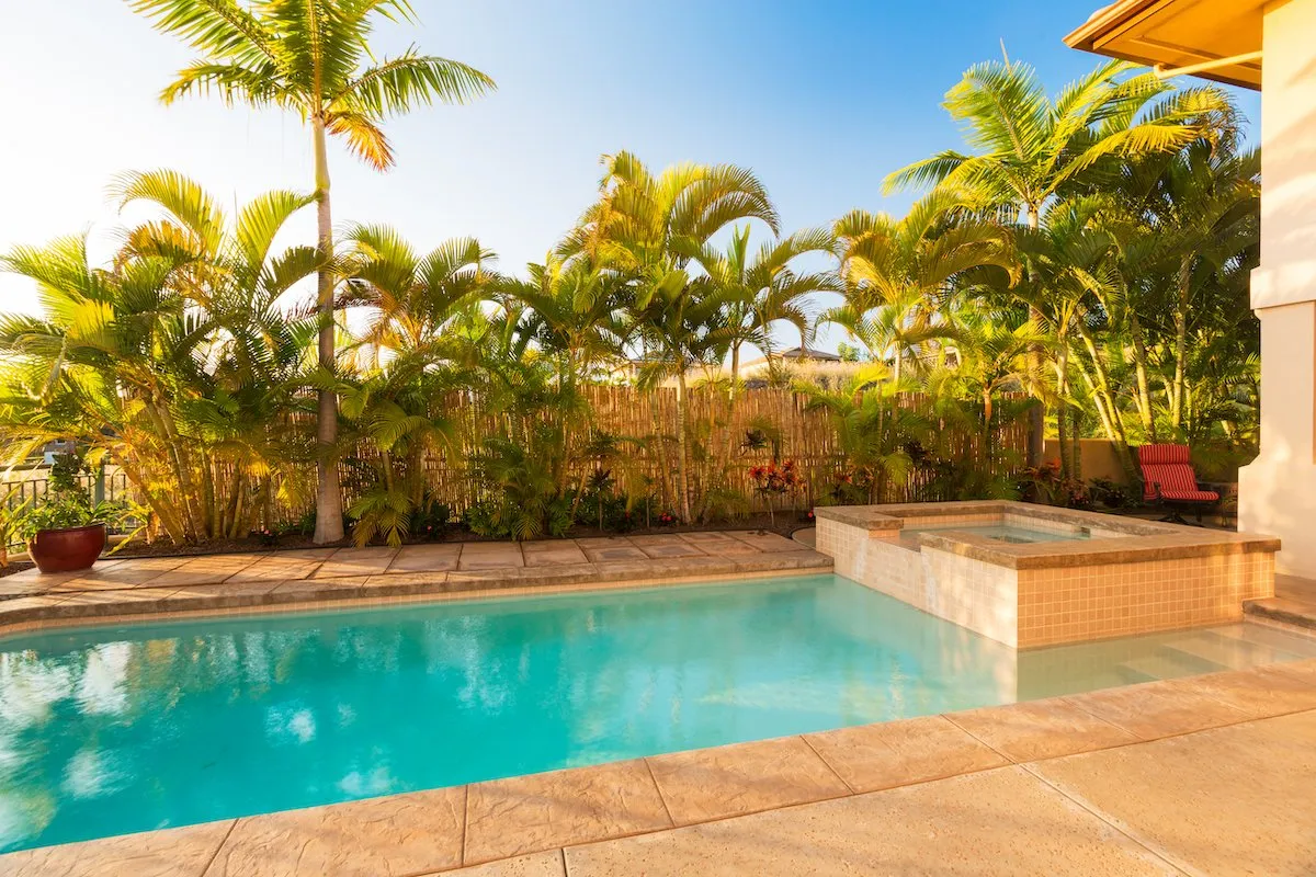 stamped concrete pool deck installed in a residential property in Naples Manor FL