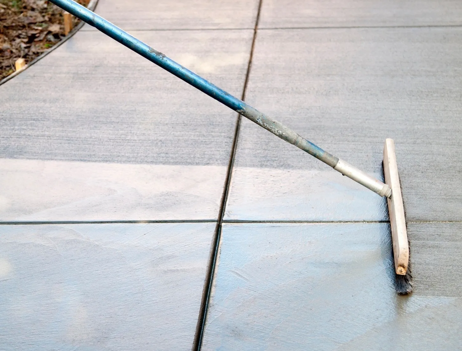 a horsehair broom is used to create a coarse finish for this newly resurfaced walkway in Marco Island, FL