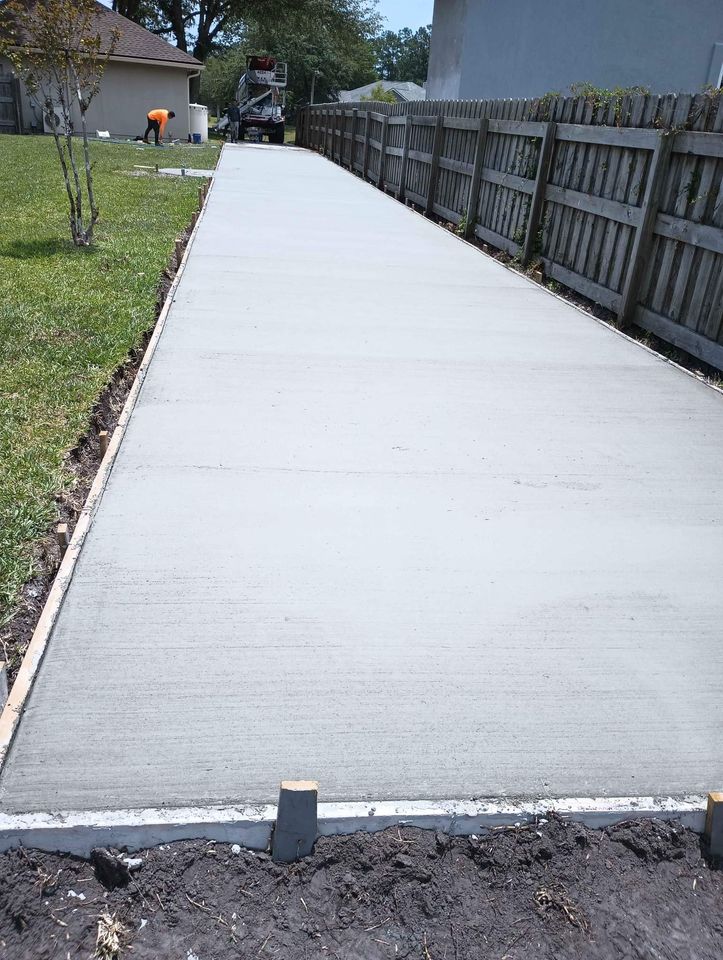 Naples Concrete Solutions pros leveling this concrete driveway in Naples